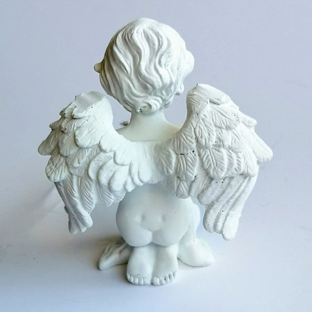 Detailed small pottery cherub child angel with diamonte cross