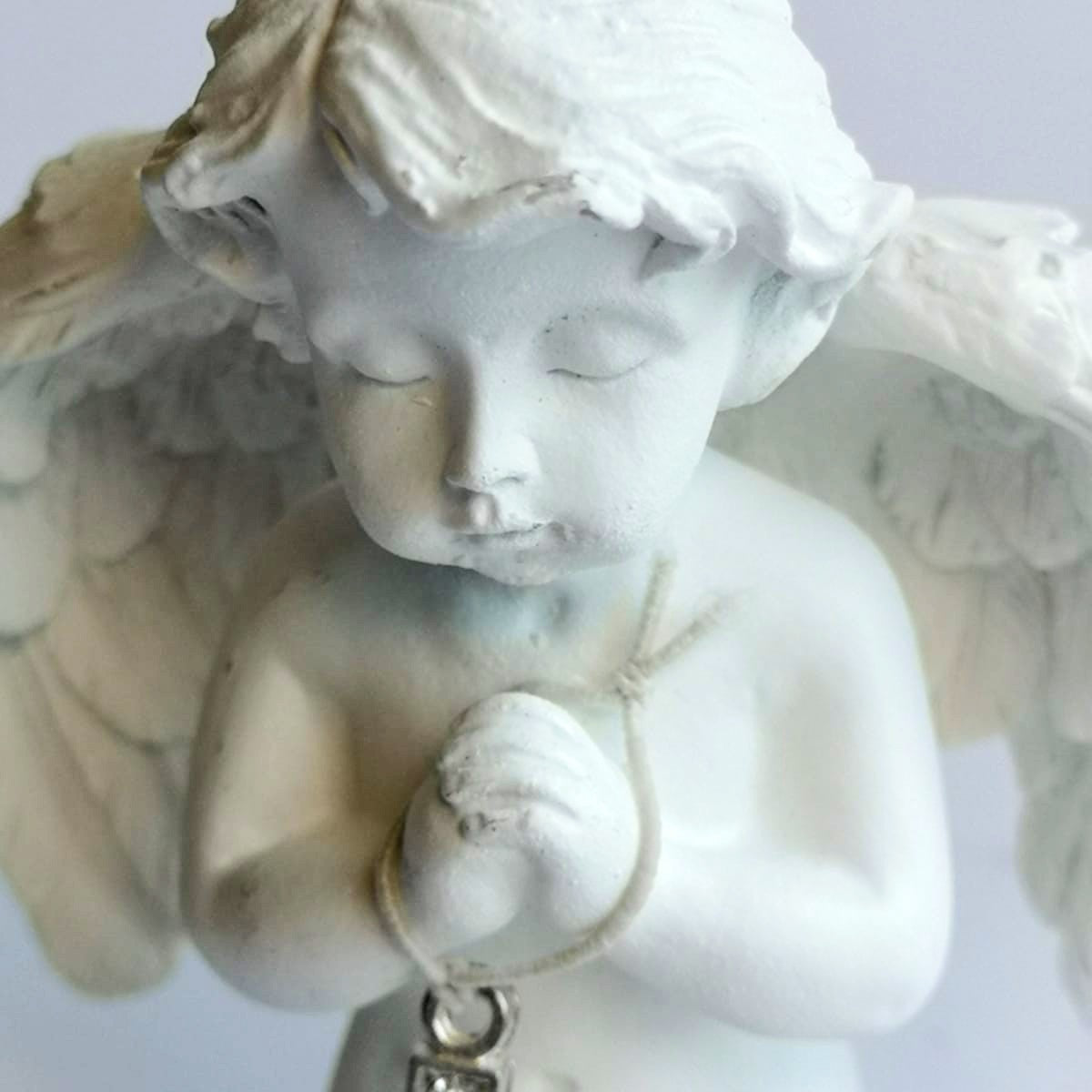 Detailed small pottery cherub child angel with diamonte cross