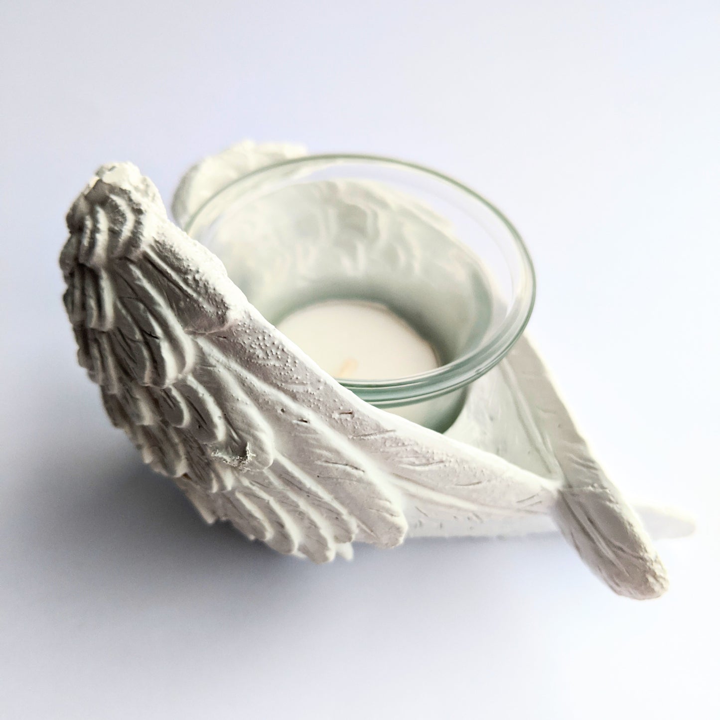 Elegant angel wing candle holder