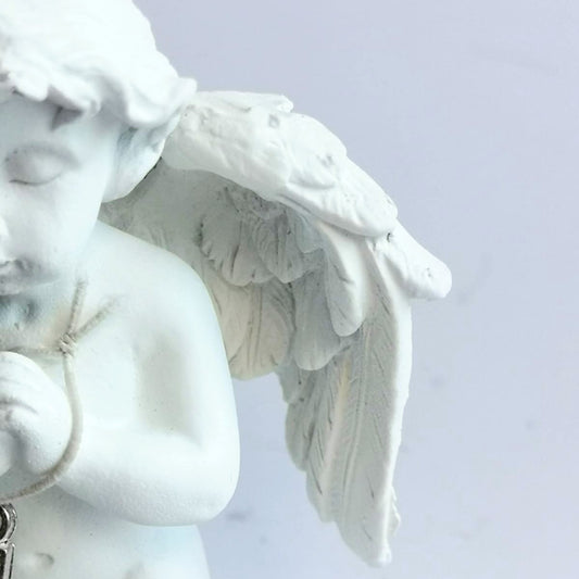 Detailed small pottery cherub child angel with diamonte cross