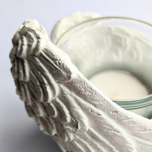 Elegant angel wing candle holder